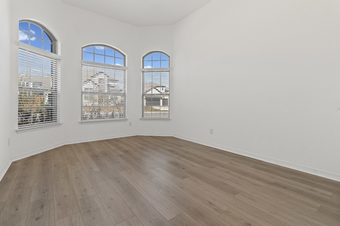 20520 Carries Ranch Road Pflugerville, TX 78660 - Photo 3 of 32 an empty room with windows