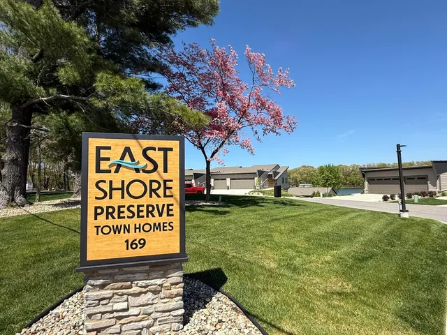 a sign board with view of a park
