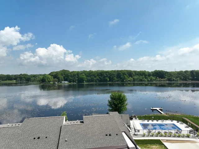 a view of a lake with a yard