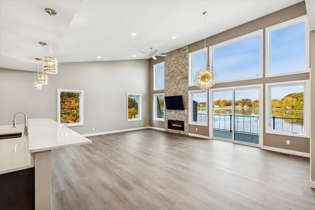 a view of a livingroom with furniture flat screen tv and window