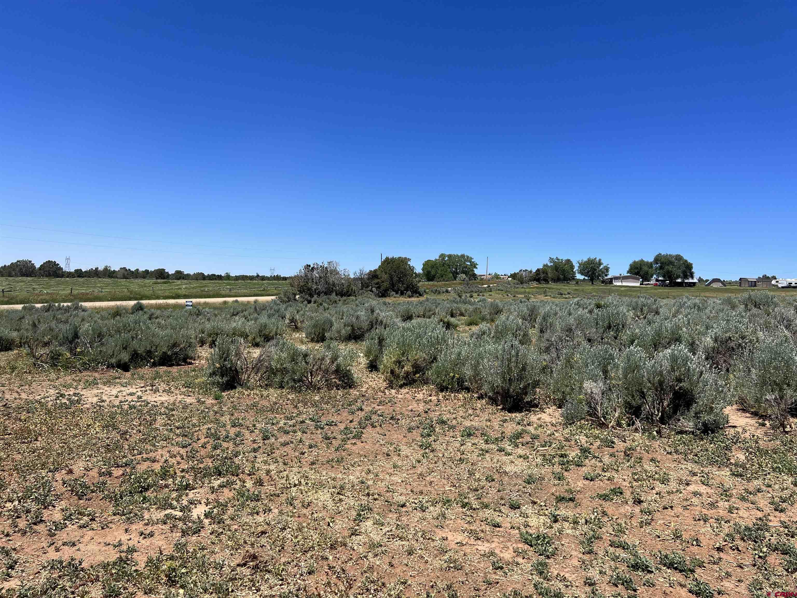Lot 2 Road P Mancos Co 81328 Mancos, CO 81328 - Photo 6 of 6 a view of a lake with sunset