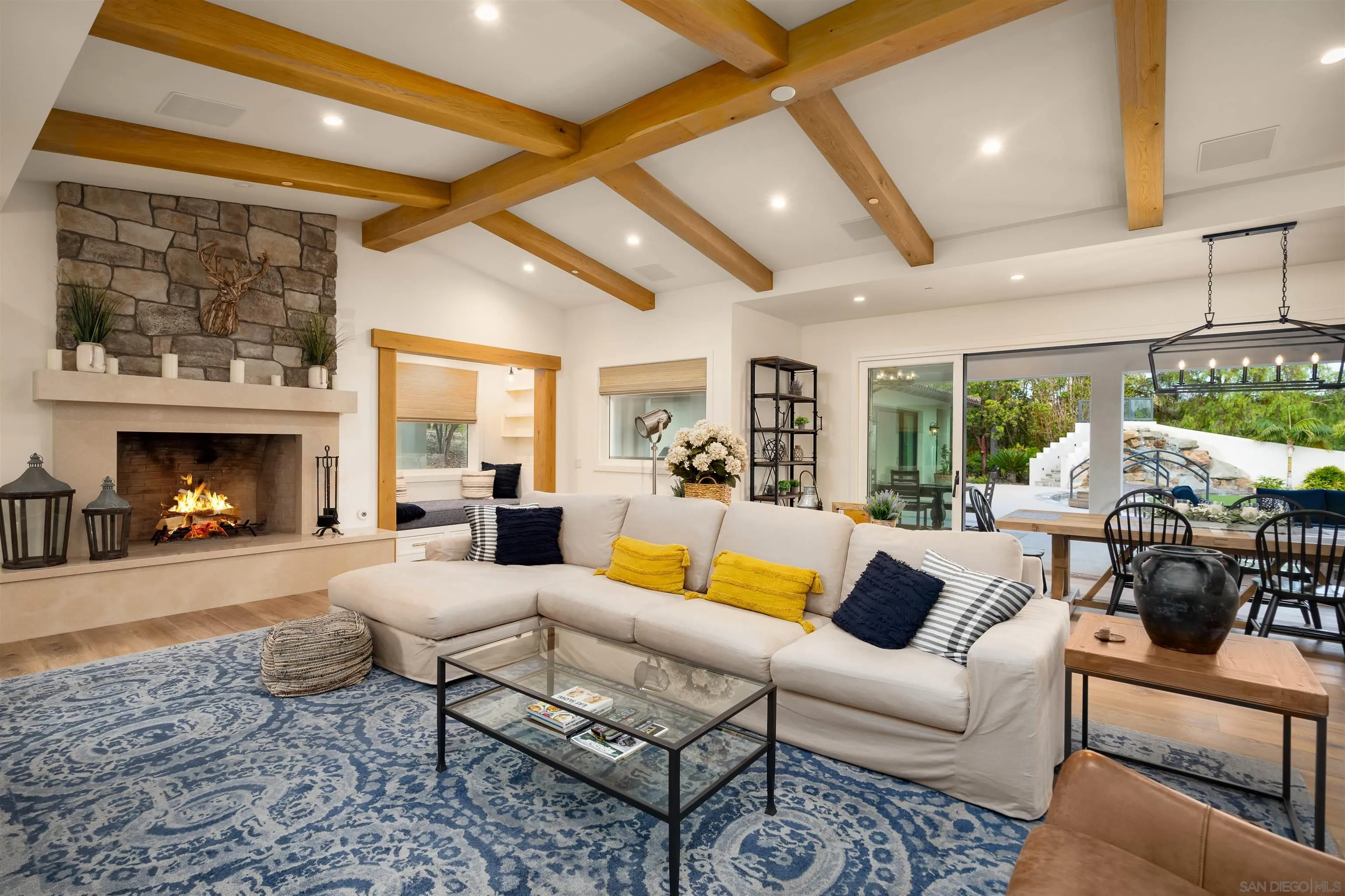 3419 Via Monteverde Encinitas, CA 92024 - Photo 14 of 73 a living room with furniture fireplace and a large window