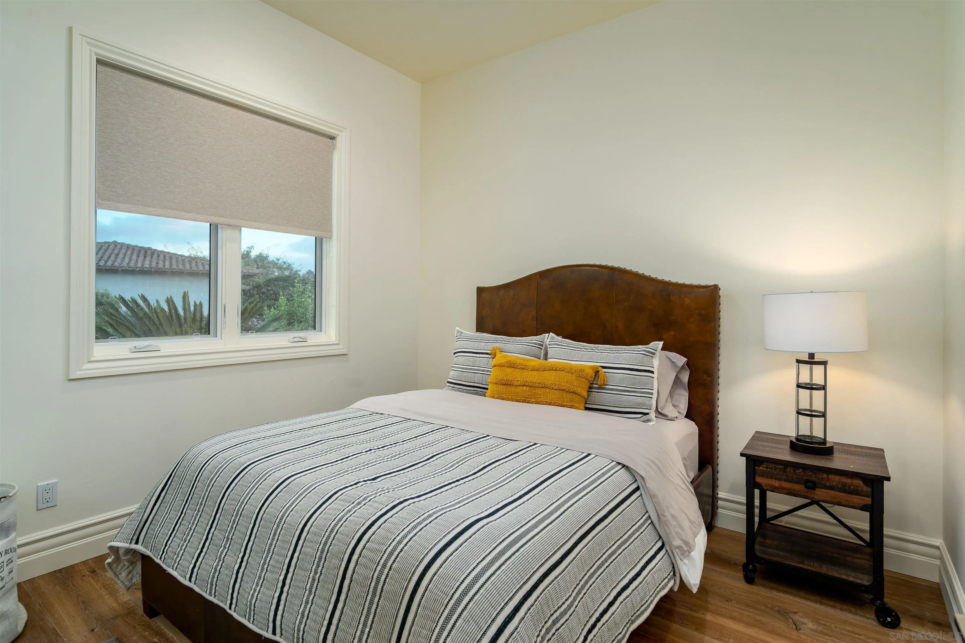 3419 Via Monteverde Encinitas, CA 92024 - Photo 43 of 73 a bedroom with a bed and wooden floor