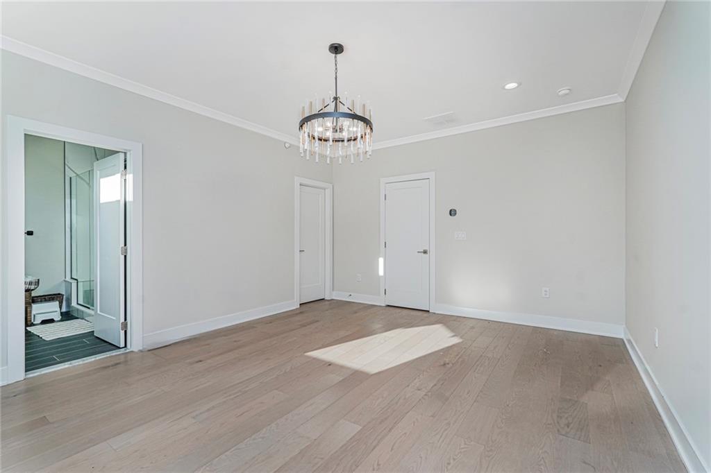 22 Edmund Way, Unit 22 Middletown, NJ 07748 - Photo 11 of 17 a view of an empty room with a chandelier