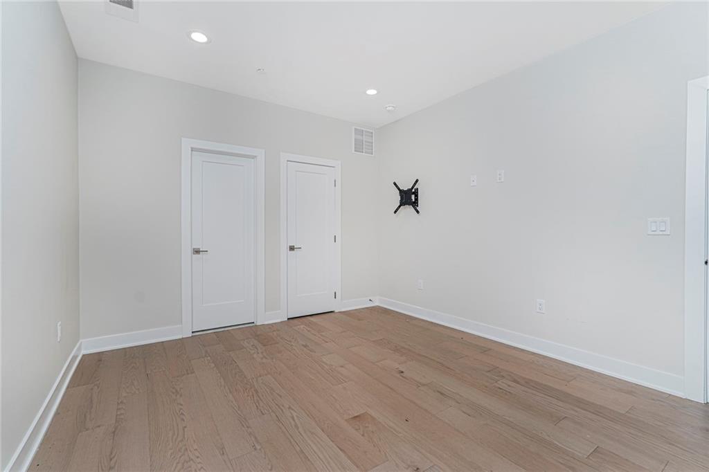 22 Edmund Way, Unit 22 Middletown, NJ 07748 - Photo 3 of 17 an empty room with a workbench