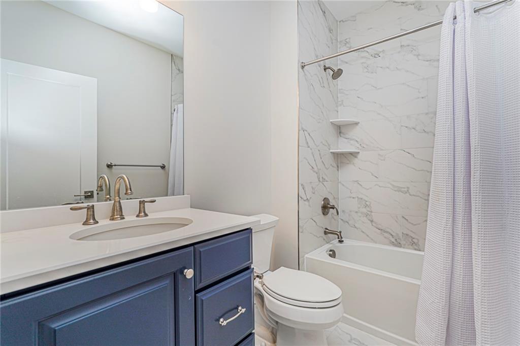 22 Edmund Way, Unit 22 Middletown, NJ 07748 - Photo 8 of 17 a bathroom with a sink a toilet and shower