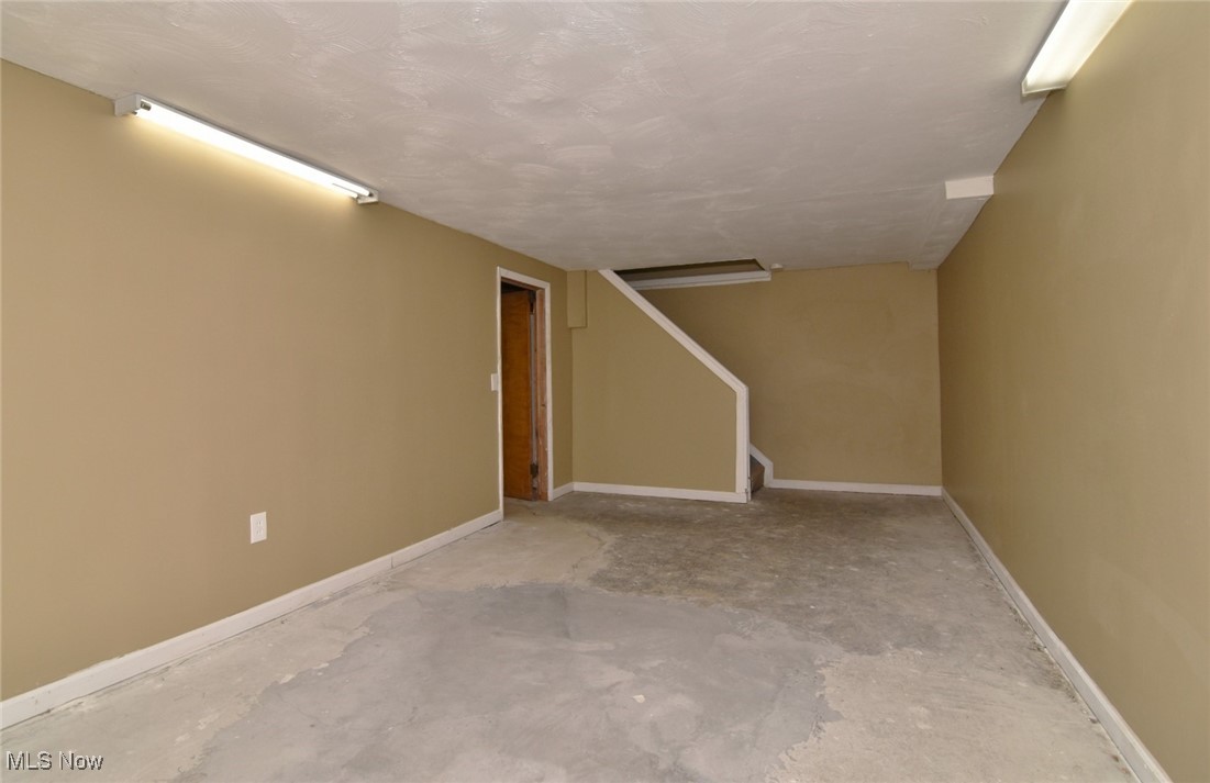 3679 Fenley Road Cleveland Heights, OH 44121 - Photo 35 of 45 Finished basement featuring a textured ceiling and stairway