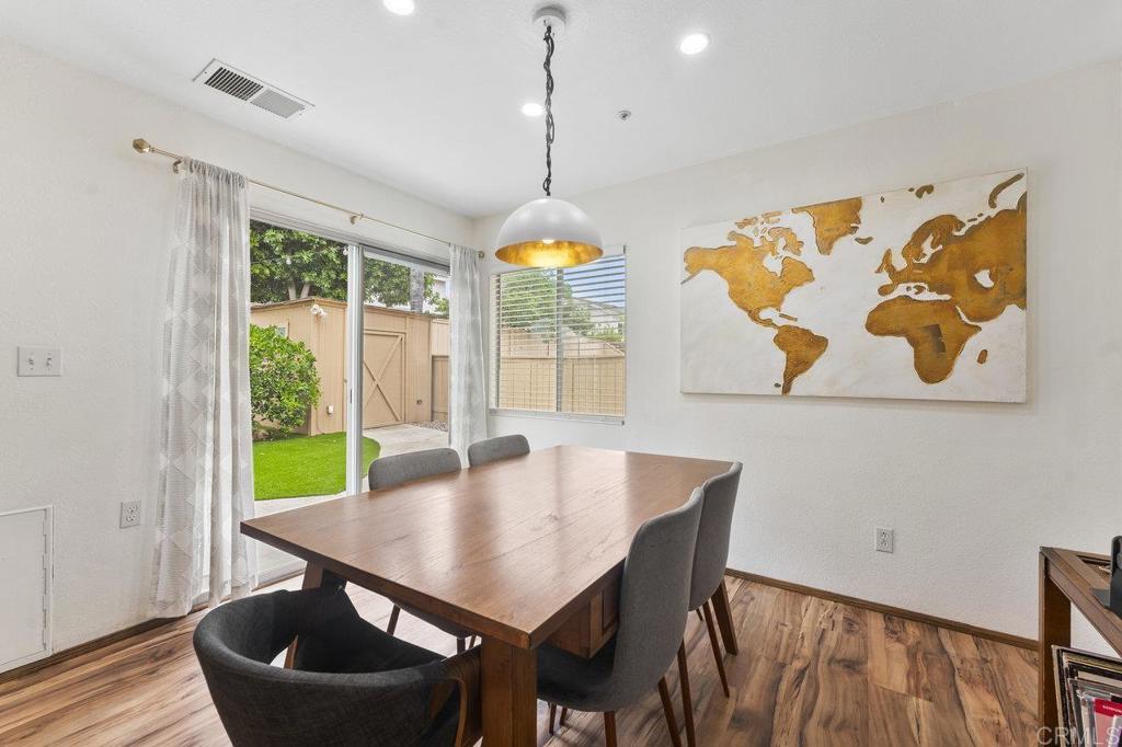305 Cobblestone Place Santee, CA 92071 - Photo 12 of 41 a view of a dining room with furniture window and wooden floor