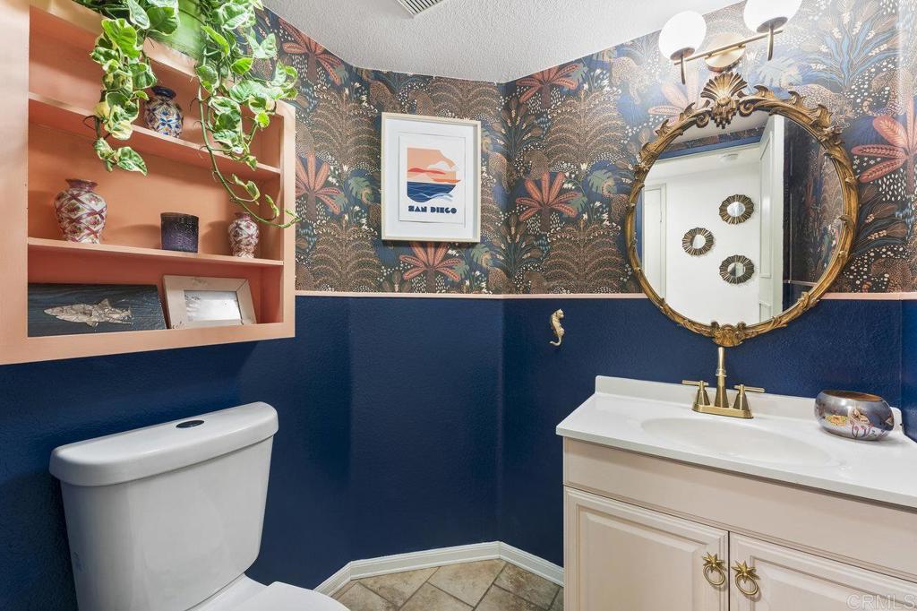 305 Cobblestone Place Santee, CA 92071 - Photo 13 of 41 a bathroom with a toilet sink and mirror