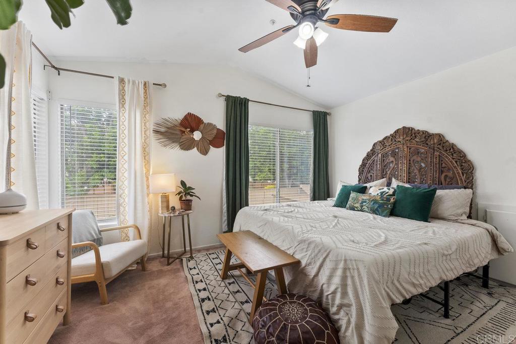 305 Cobblestone Place Santee, CA 92071 - Photo 19 of 41 a bedroom with a bed and a chandelier