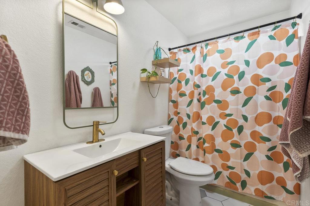 305 Cobblestone Place Santee, CA 92071 - Photo 24 of 41 a bathroom with a sink and a mirror