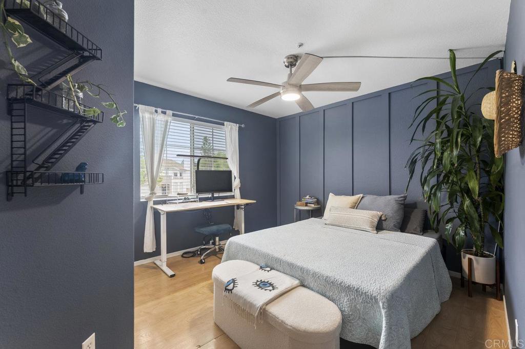 305 Cobblestone Place Santee, CA 92071 - Photo 25 of 41 a bedroom with a bed and a chandelier