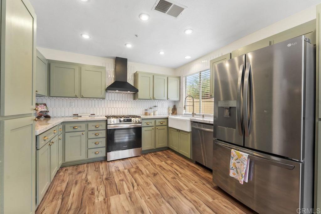 305 Cobblestone Place Santee, CA 92071 - Photo 9 of 41 a kitchen with a refrigerator stove and sink