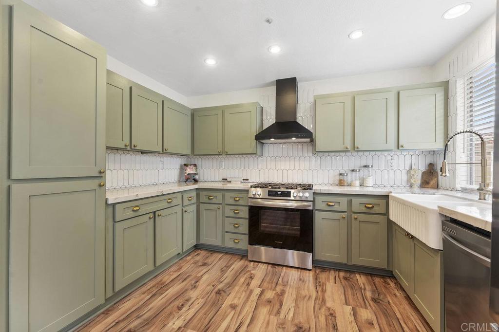 305 Cobblestone Place Santee, CA 92071 - Photo 10 of 41 a kitchen with stainless steel appliances granite countertop a sink stove and refrigerator