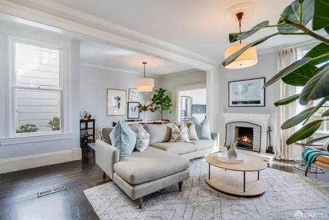 a living room with furniture rug and white walls
