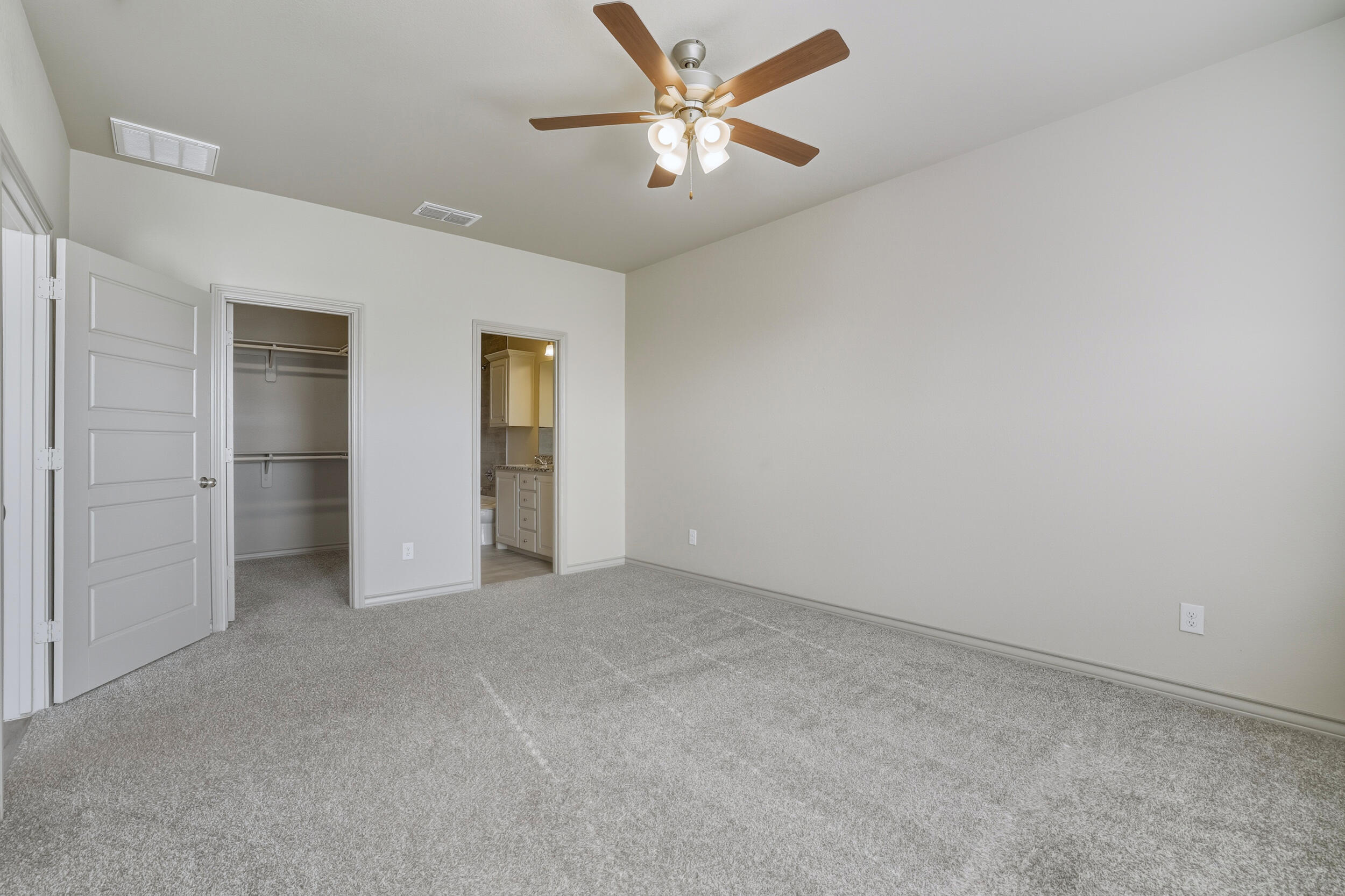 7103 22nd Street Lubbock, TX 79407 - Photo 14 of 30 an empty room with closet and a ceiling fan