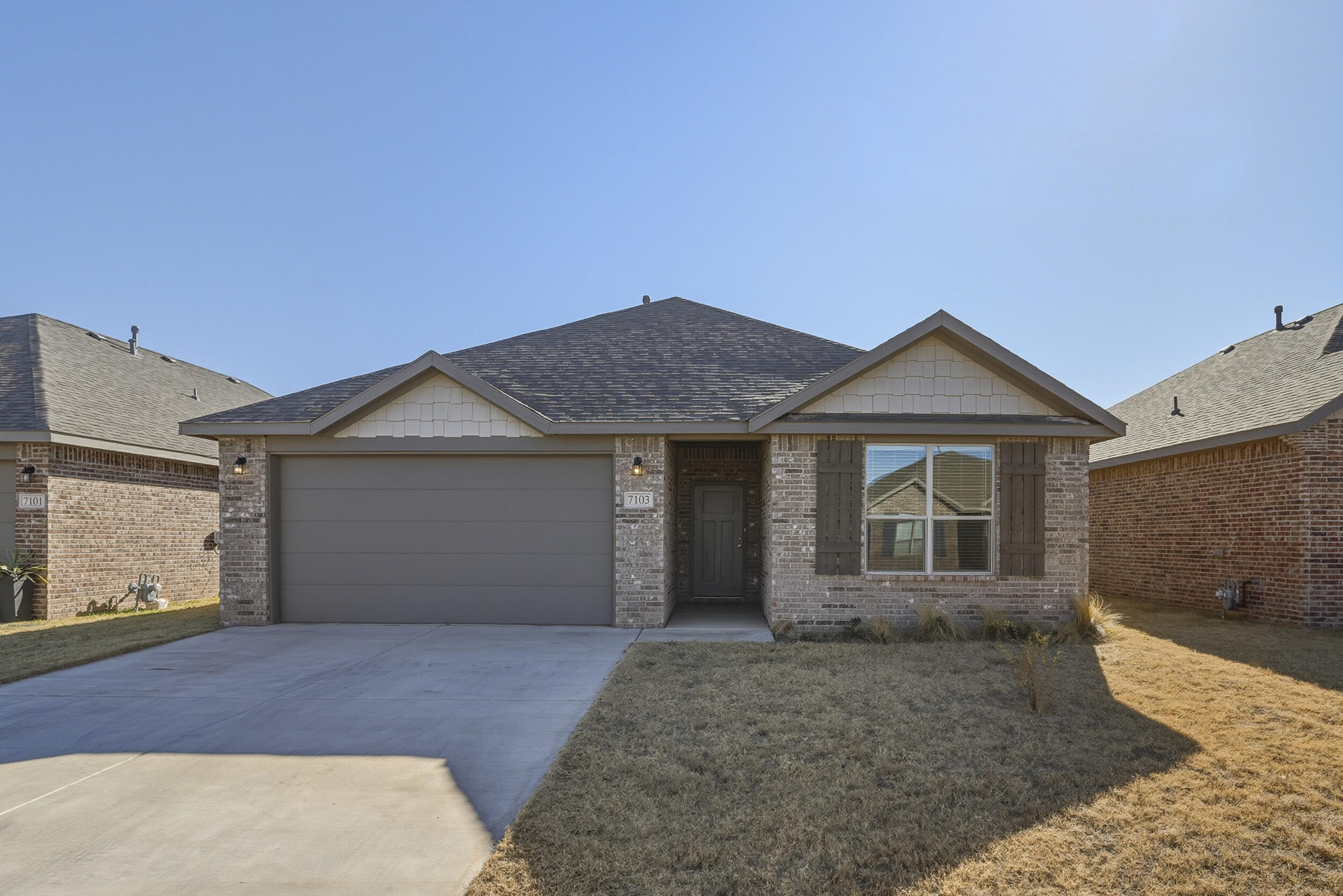 7103 22nd Street Lubbock, TX 79407 - Photo 2 of 30 front view of a house with a yard