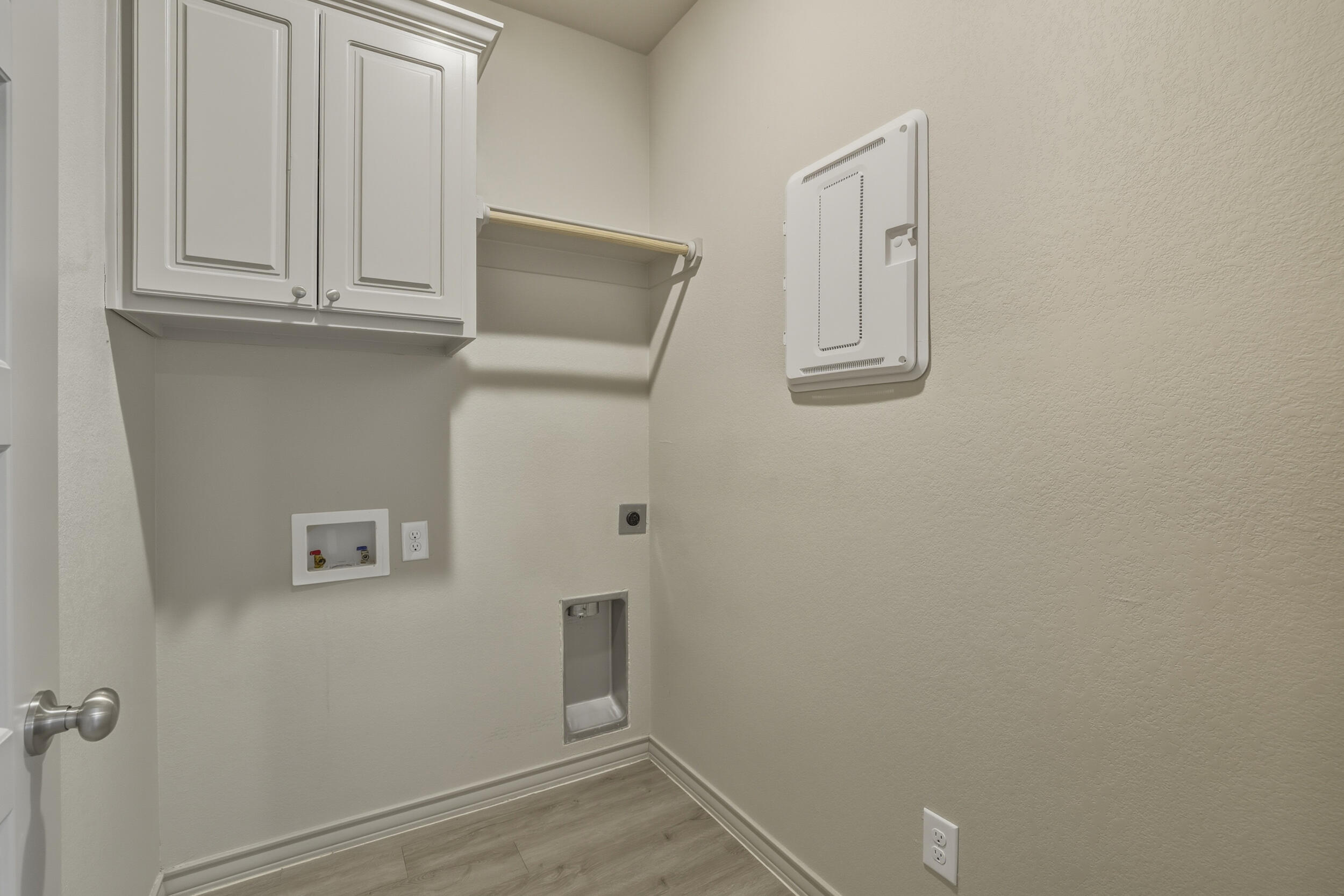 7103 22nd Street Lubbock, TX 79407 - Photo 26 of 30 a view of a utility room with cabinets
