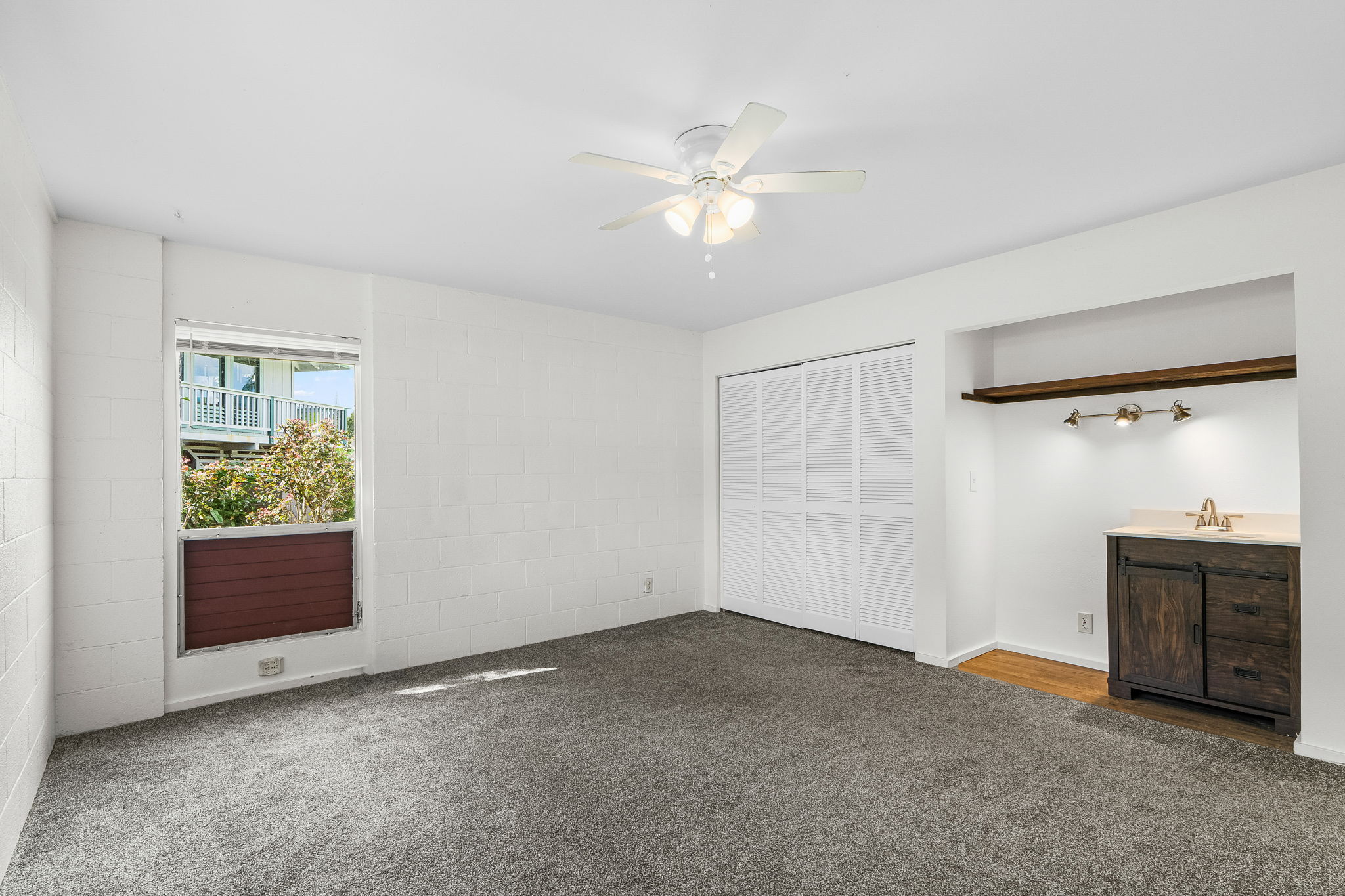 388 Molo Street Kapaa, HI 96746 - Photo 13 of 27 an empty room with windows and ceiling fan
