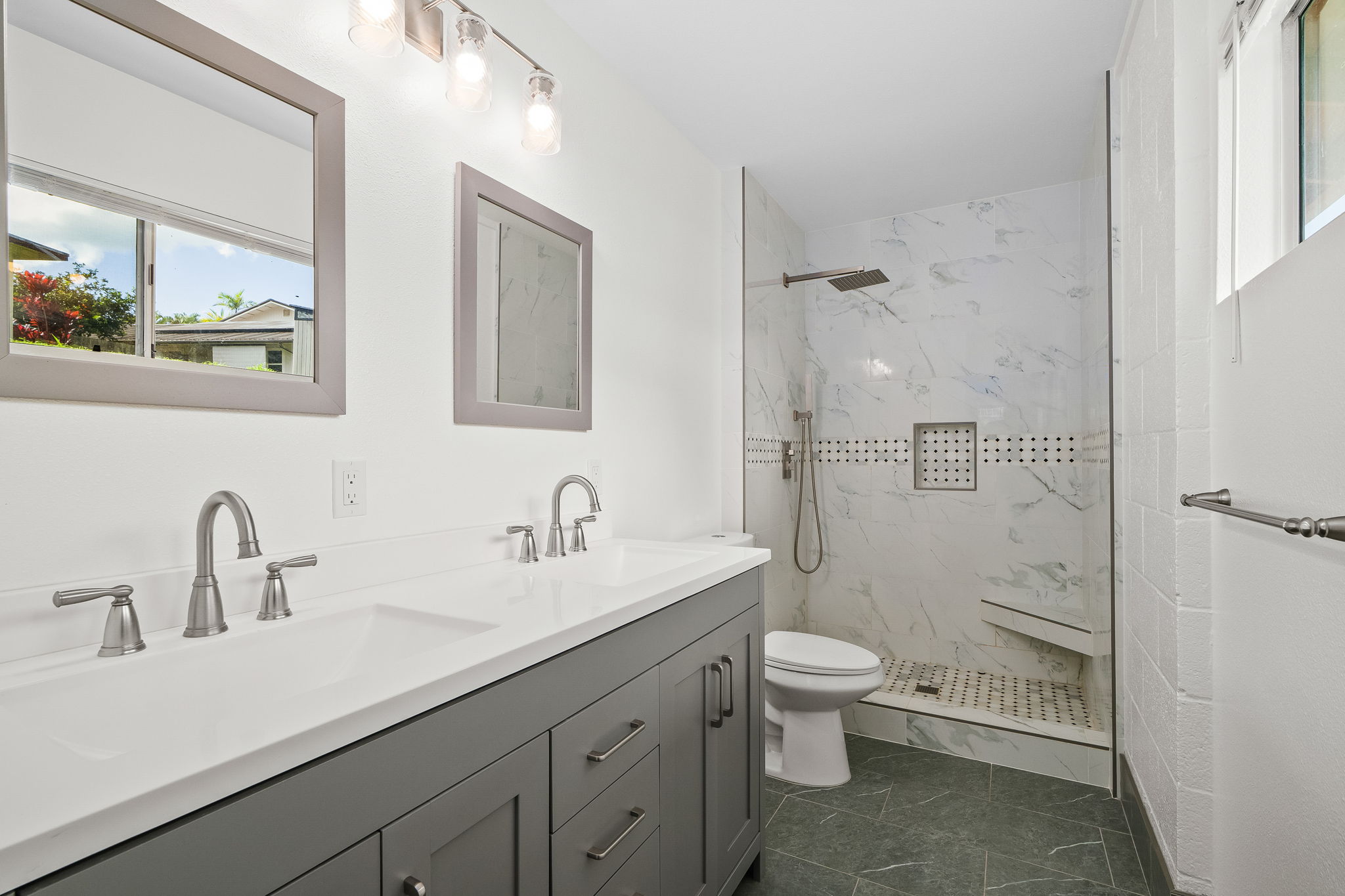 388 Molo Street Kapaa, HI 96746 - Photo 14 of 27 a bathroom with a sink a toilet and shower