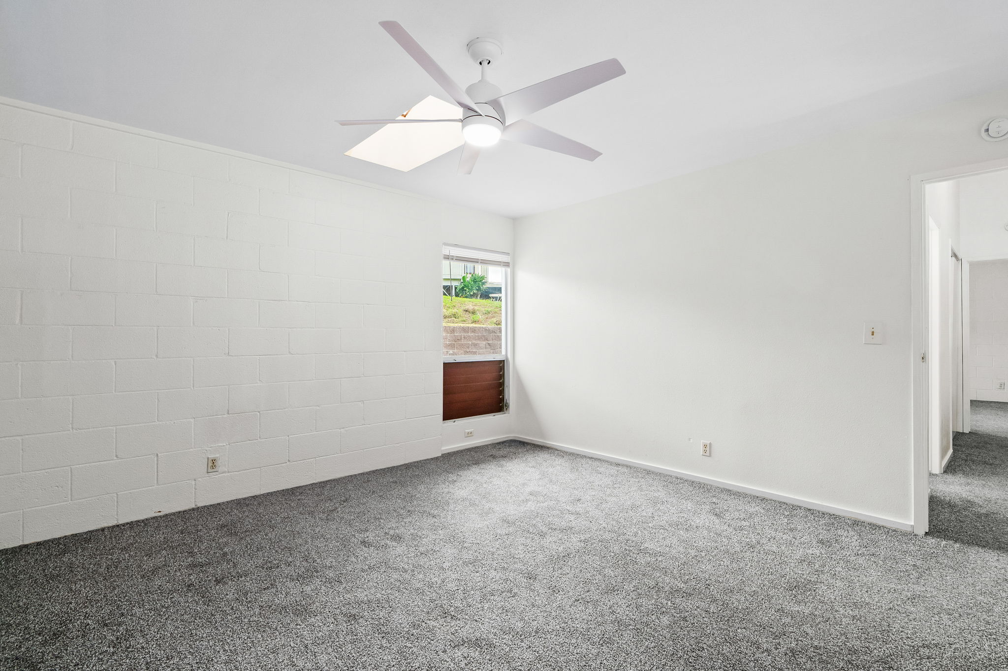 388 Molo Street Kapaa, HI 96746 - Photo 18 of 27 an empty room with a window and a fan