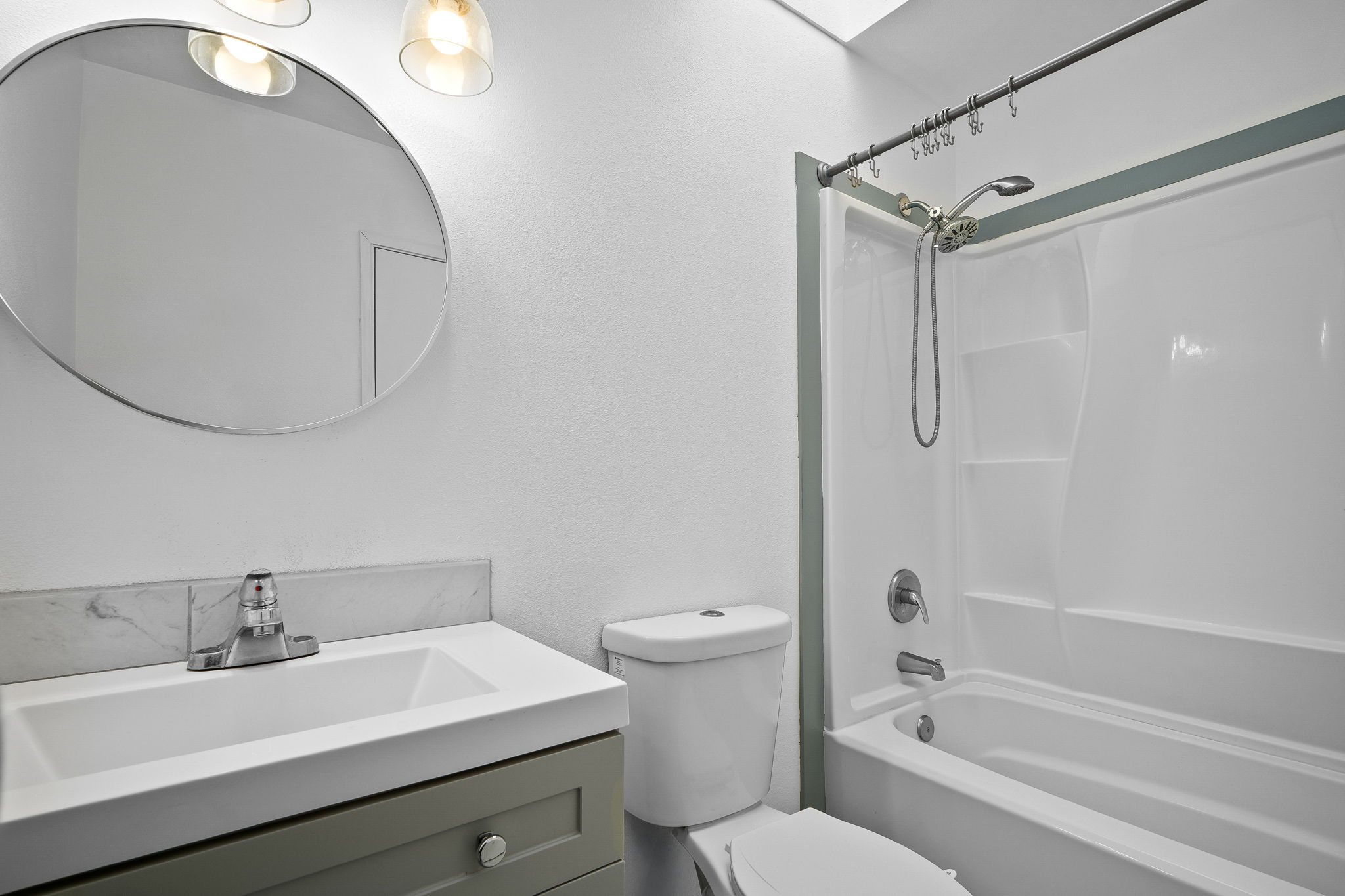 388 Molo Street Kapaa, HI 96746 - Photo 19 of 27 a bathroom with a sink a toilet and a mirror