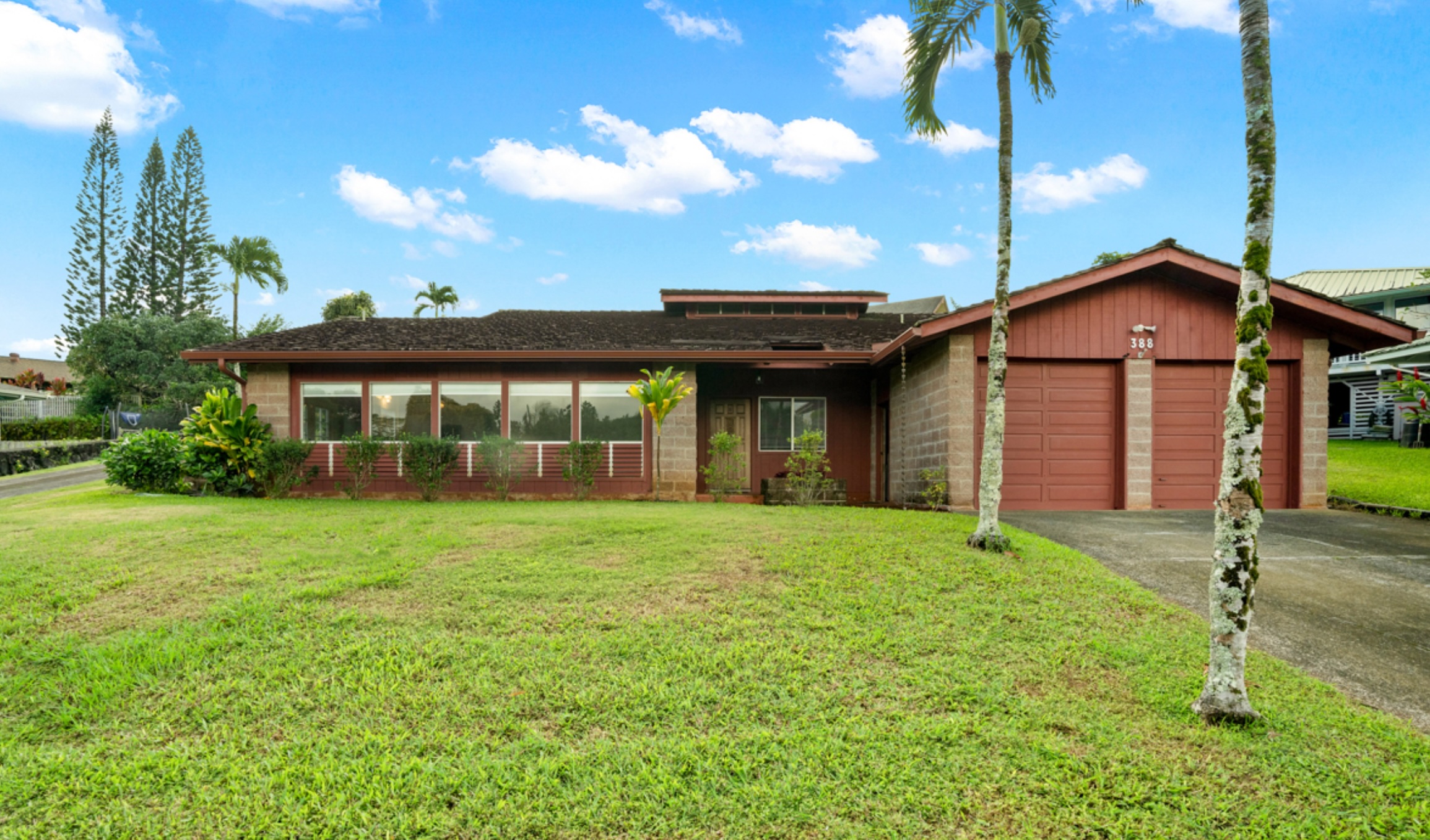388 Molo Street Kapaa, HI 96746 - Photo 22 of 27 a front view of a house with a yard