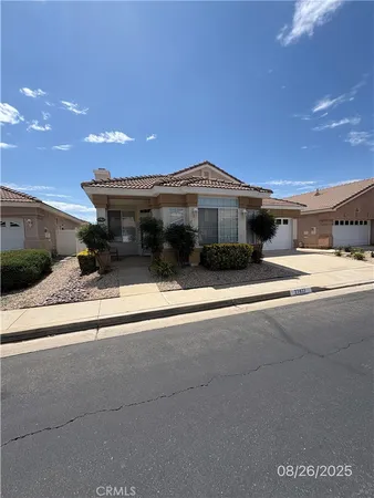 a front view of a house with yard