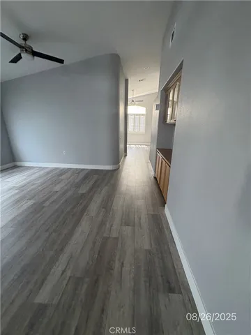 a view of hallway with wooden floor