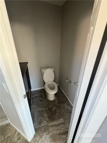 a bathroom with a toilet and a sink