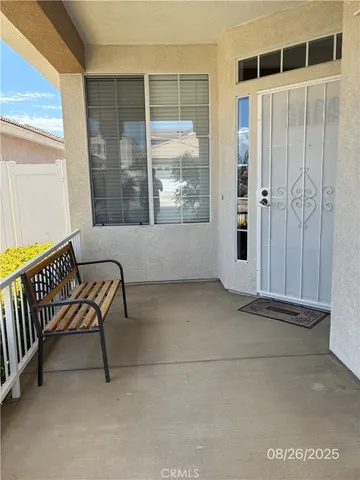 a view of a porch with a bench