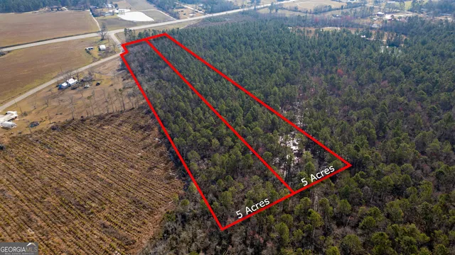 a view of a yard with an ocean view