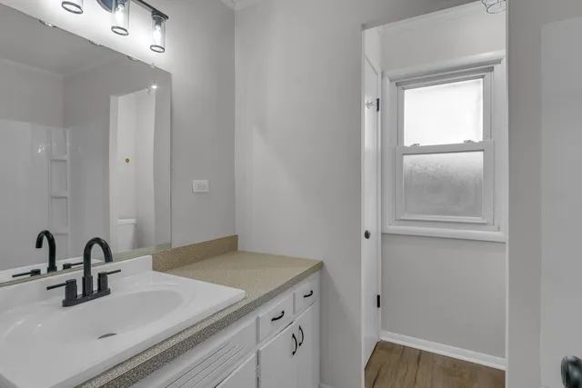 a bathroom with a sink and a mirror