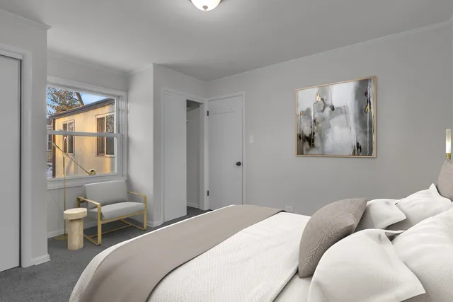 a bedroom with a bed and a couch