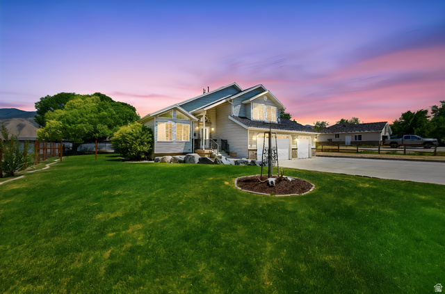 3732 Campbell Road Tooele, UT 84074 - Photo 68 of 69 Spacious front yard with mature landscaping and a well-maintained lawn