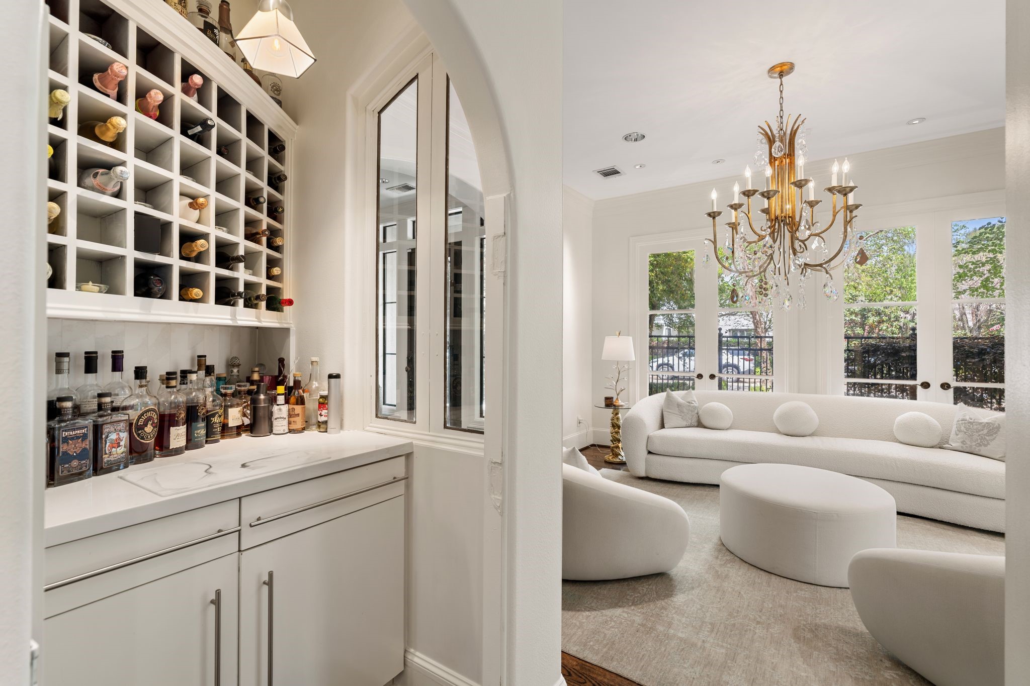 30 Hackberry Lane, Unit A Houston, TX 77027 - Photo 20 of 42 Dry bar with quartz counters, built-in cabinetry, and a 42-bottle wine cubby storage.