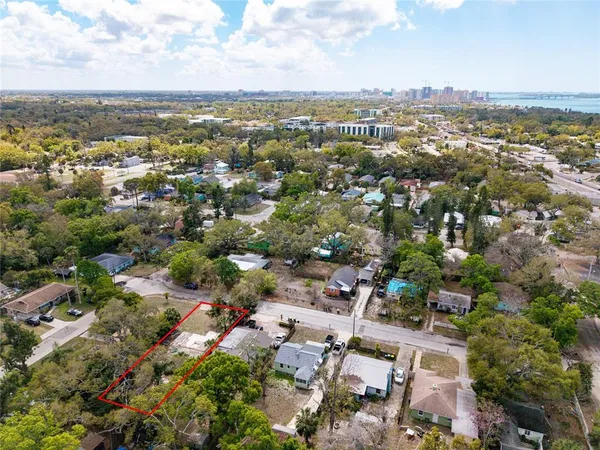 an aerial view of residential building with green space