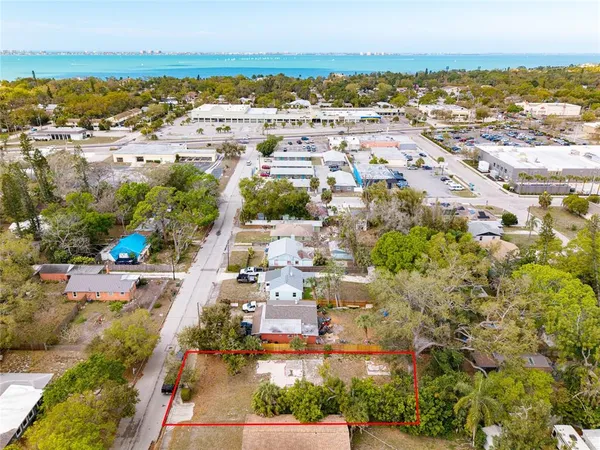 an aerial view of residential building and lake