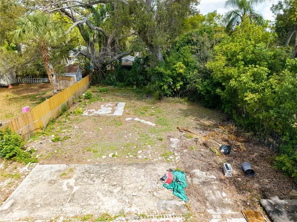 a view of yard with swimming pool