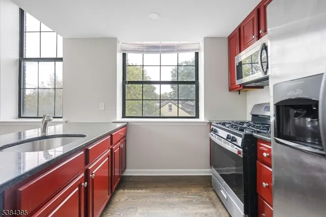 a kitchen that has a sink and a stove