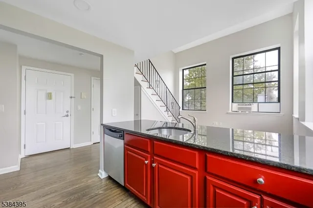 a view of cabinets and wooden floor