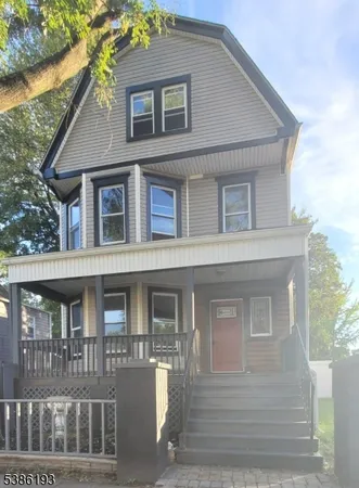 a view of a small house with an entryway