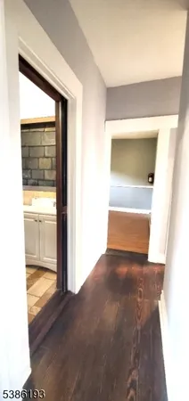 a view of a living room with a wooden floor