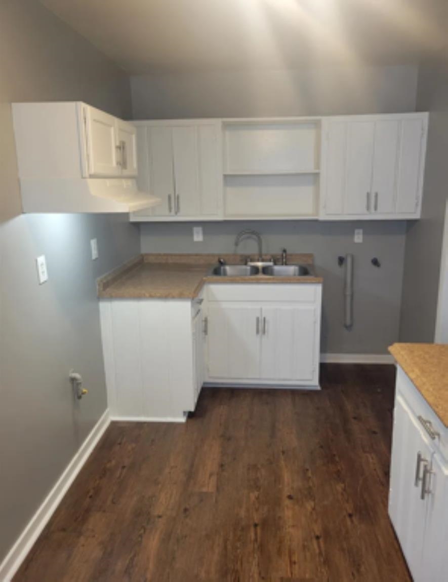 386 Elder Road Memphis, TN 38109 - Photo 6 of 12 a kitchen with a sink a stove and cabinets