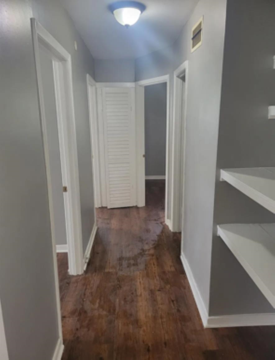 386 Elder Road Memphis, TN 38109 - Photo 7 of 12 a view of a hallway with wooden floor