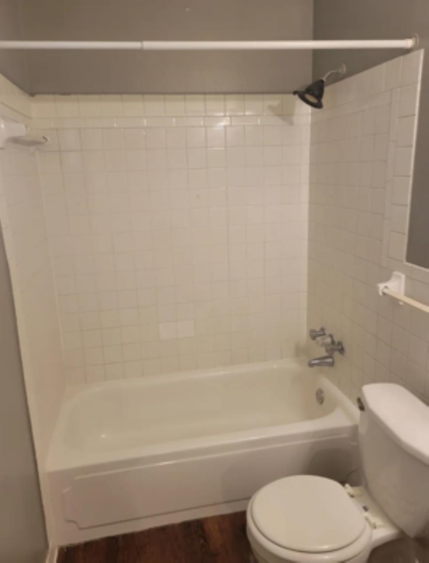 386 Elder Road Memphis, TN 38109 - Photo 8 of 12 a bathroom with a toilet and a bathtub