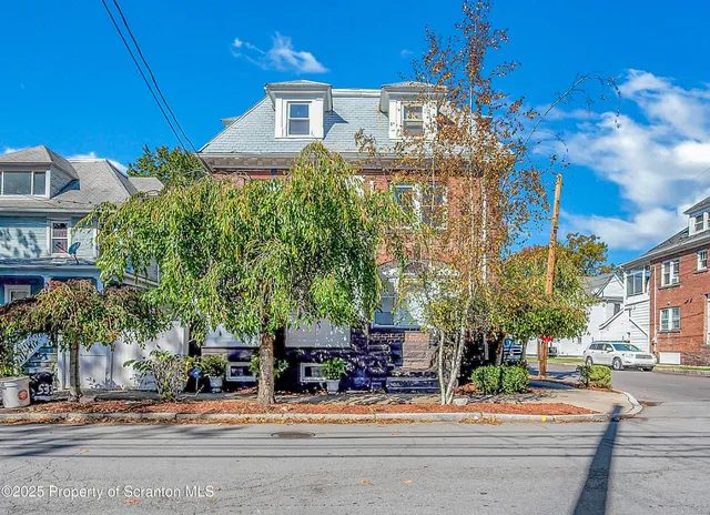 a outdoor view of a building with traffic signal lights