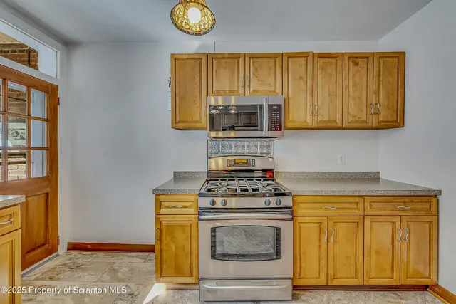 a kitchen with a stove and a microwave