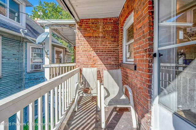 a view of front door of a house with stairs