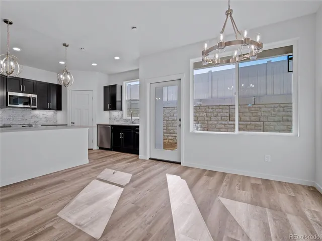 a view of a kitchen with a sink and cabinets